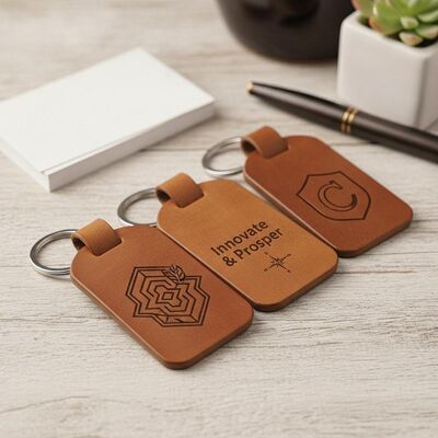 calidad Etiquetas para llaves de cuero con logotipo grabado con láser Diseño clásico Ideal para marcas comerciales y accesorios corporativos personalizados fábrica