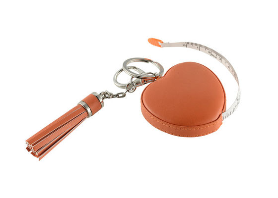 Buen precio El laser que graba las borlas retractables del corazón de la cinta métrica ata con correa el regalo del recuerdo en línea